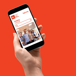 a hand holds up a mobile phone