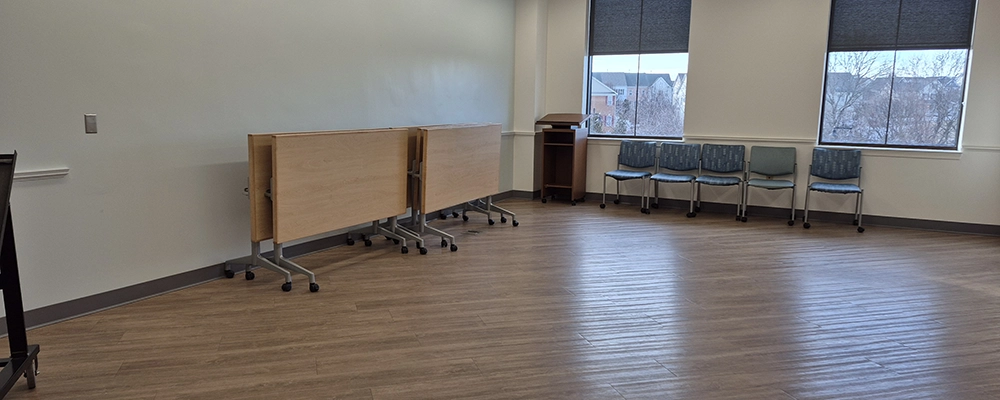 a view of the small conference room a brightly lit space