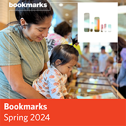 Bookmarks Spring 2024 - a woman holds a baby at a library event