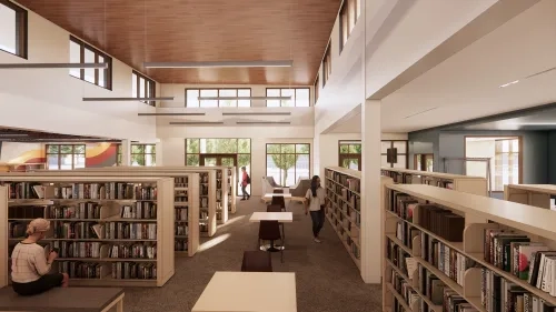 A rendering of how the bookstacks will look. Sunshine streams into the space from many windows.